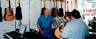 Charlie shows a customer a guitar at Mercer Music